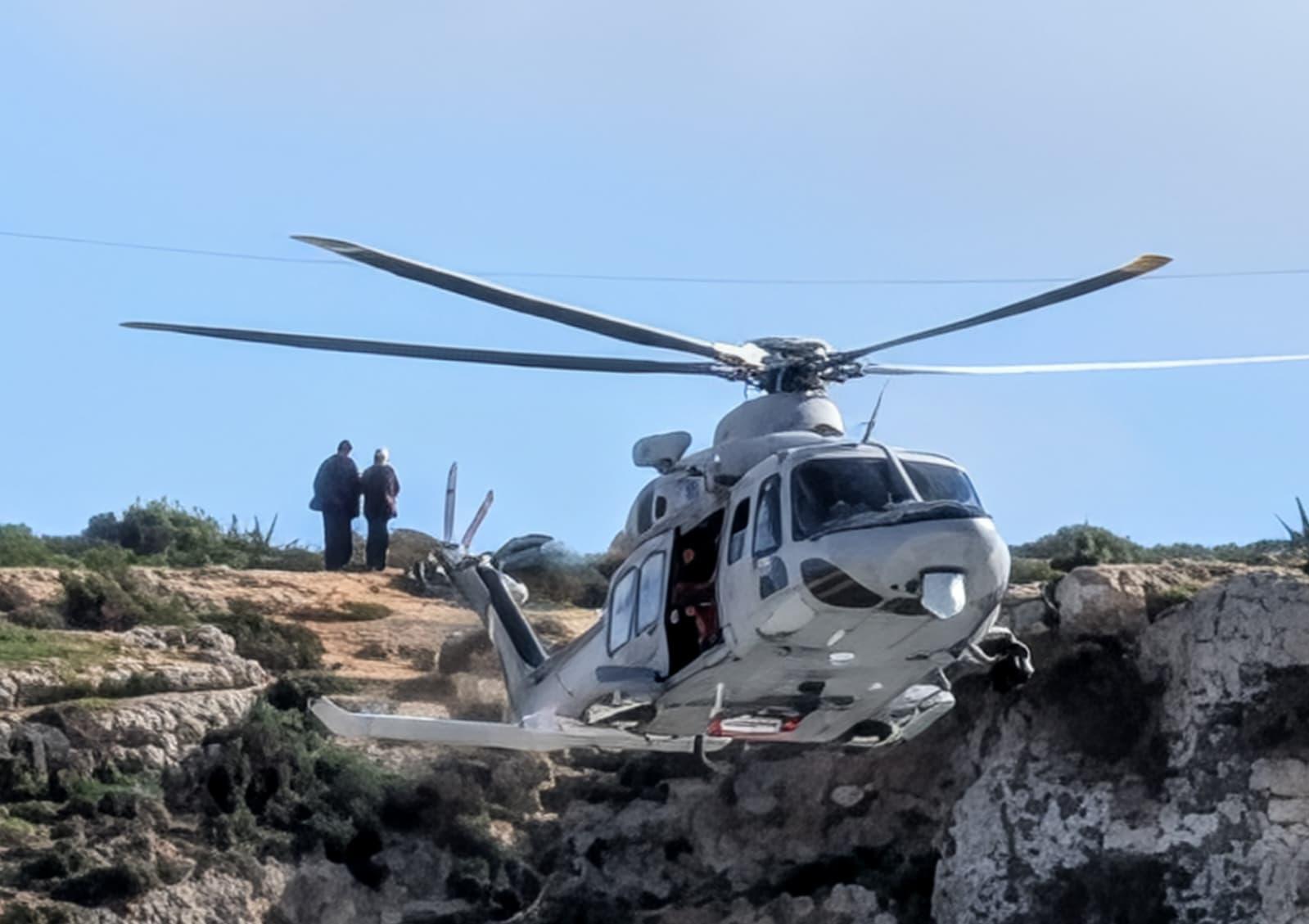An AFM helicopter flies low during the search for the missing girl. Photo Chris Sant Fournier.