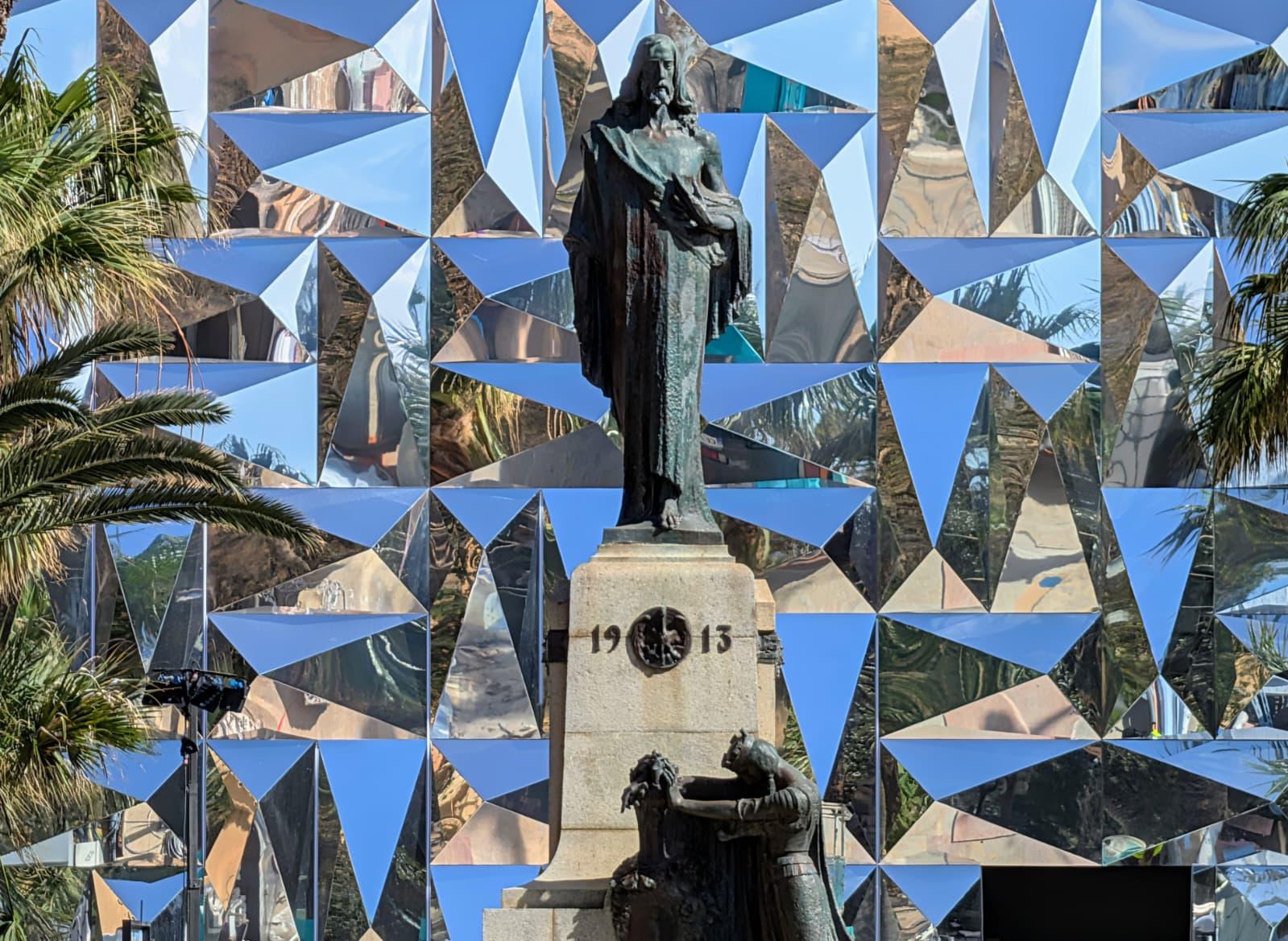 Antonio Sciortino's Christ the King statue set against the backdrop of the Vision 2050 pavilion. Photo: Chris Sant Fournier