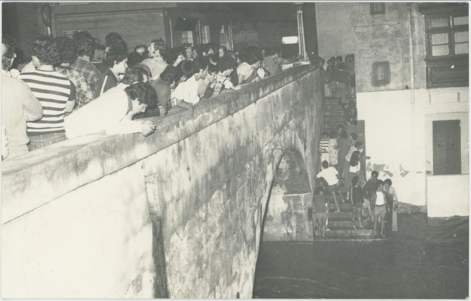 October 25, 1979: People looking over a bridge in Birkirkara seeing the flooded area. Photo: The National Archives of Malta