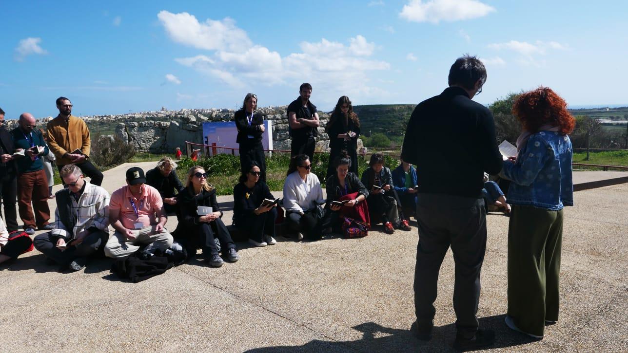 Modica&rsquo;s prayer in action in front of Debono&rsquo;s work. Photo: Concetta Modica