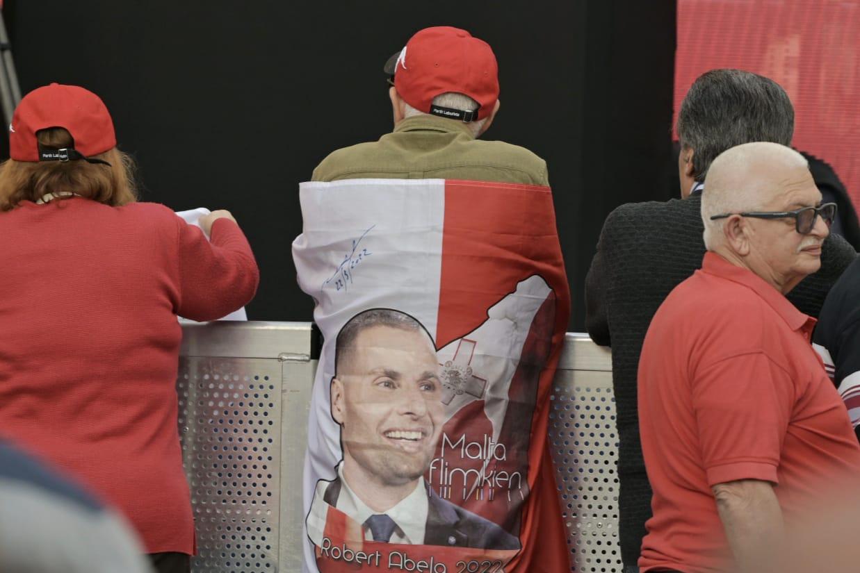 Robert Abela's got your back? A Labour supporter draped in a party flag in Żejtun. Photo: Matthew Mirabelli