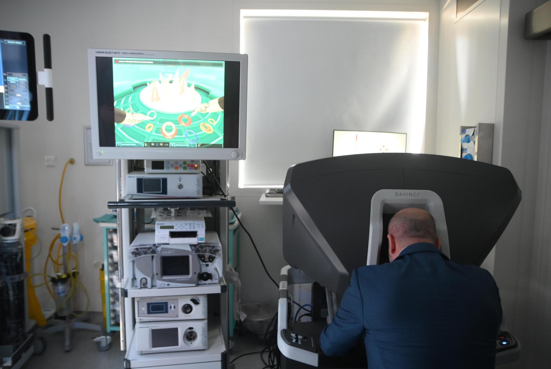 Camenzuli showing how surgeons use the machine. Photo: Jonathan Borg