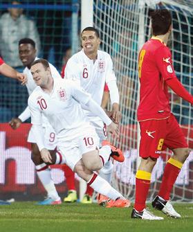England&rsquo;s Wayne Rooney runs to his team-mates after scoring against Montenegro, in Podgorica, last month.