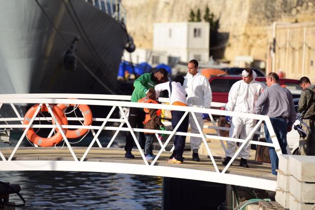 A young migrant is inspected upon arrival in Malta. Photo: Mark Zammit Cordina