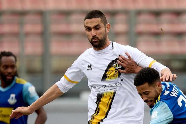 Court overturns footballer's game fixing conviction, jail term