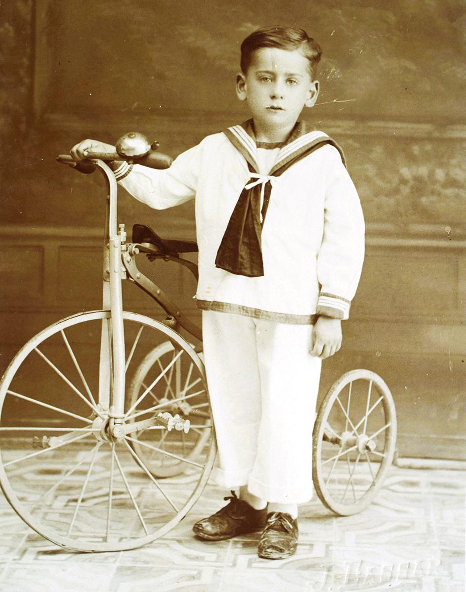 A child, S. Dingli, with a tricycle, photographed by Joseph Cassar of Ħamrun.
