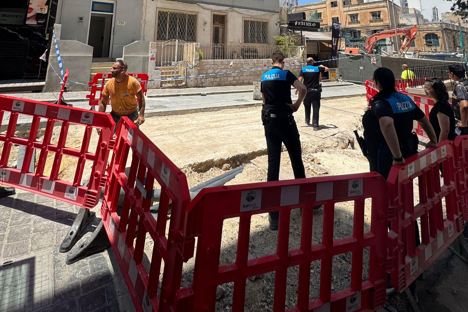 Police officers at the site earlier on Wednesday as residents were evacuated.