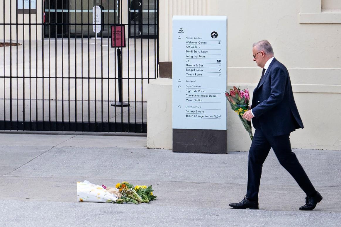Australia's Prime Minister Anthony Albanese laying flowers at the Bondi Pavillion at Bondi Beach.
