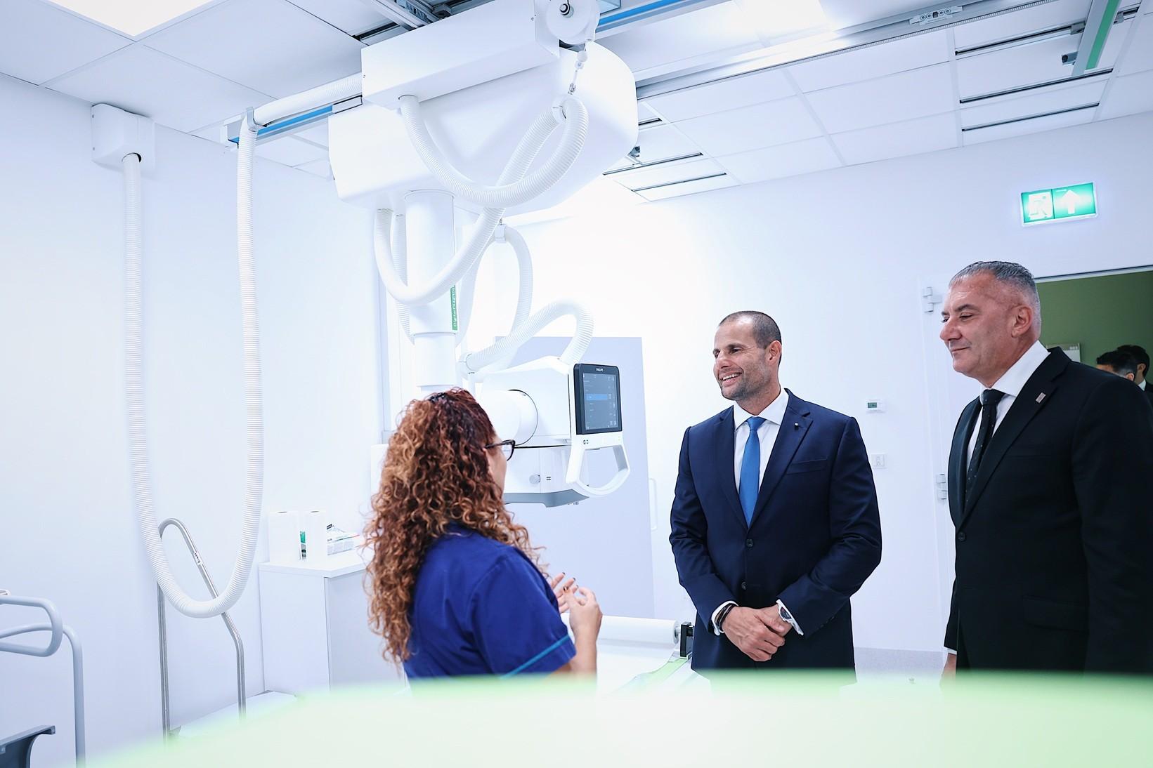 Prime Minister Robert Abela and Health Minister Jo Etienne Abela meet staff at the Paola health hub.