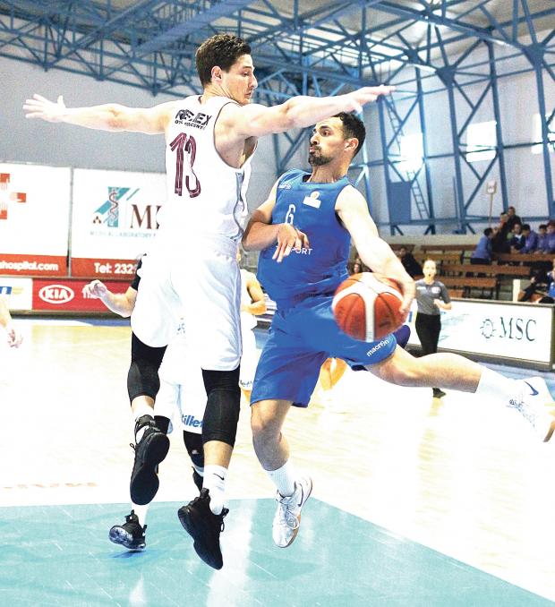 Starlites player Robert Bonnici passes the ball past Vince Pace, of Gżira Athleta. Photo: Wally Galea