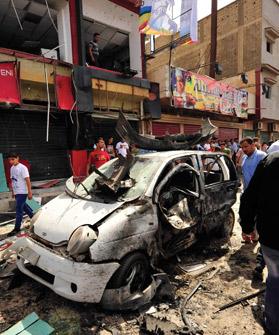 People gathered at the scene of a car bomb explosion outside a hospital in Benghazi, Libya, yesterday. Photo: Reuters