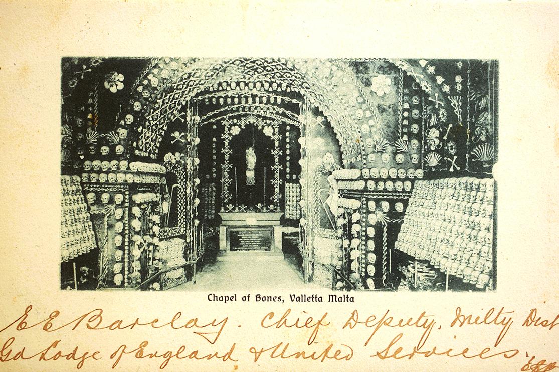 A postcard with a masonic handwritten message, front and back.