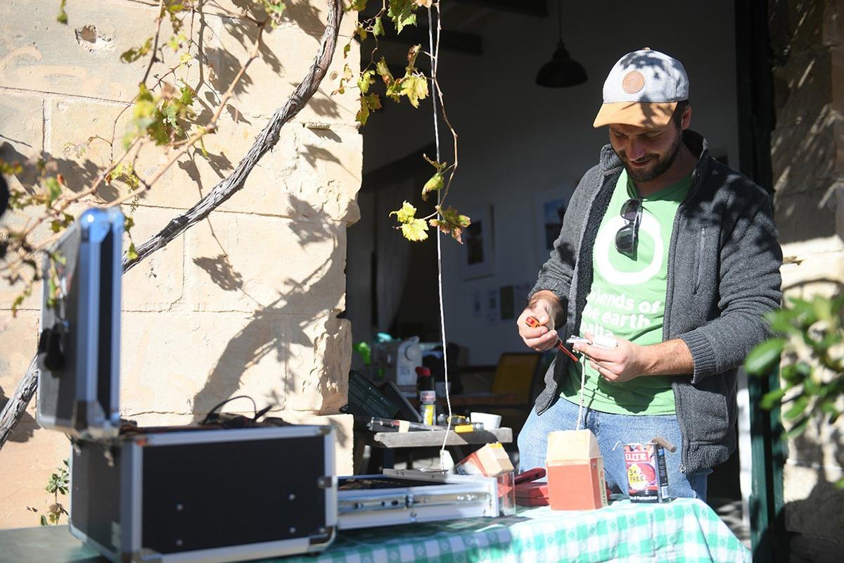 One of the members of Friends of the Earth with his toolbox.