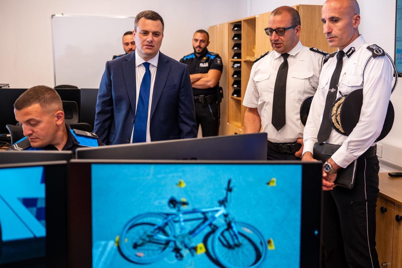 Home Affairs Minister Byron Camilleri and Police Commissioner Angelo Gaf&agrave; (right) visit the offices of the new Roads Policing Unit. (DOI)