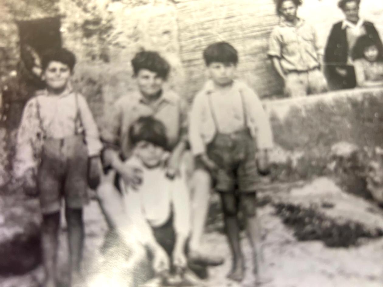 Nazzareno (first from the left) as a young boy.