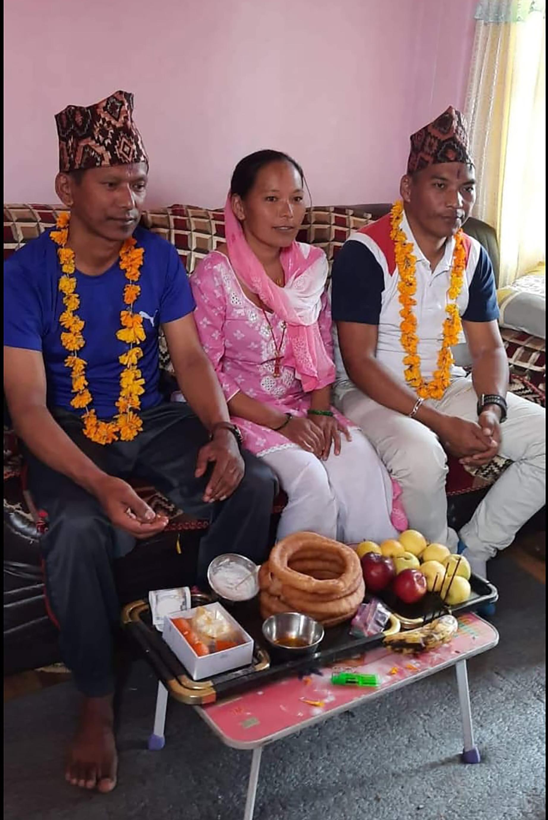 Khim, right, with his younger sister, Nardevi, and their older brother.