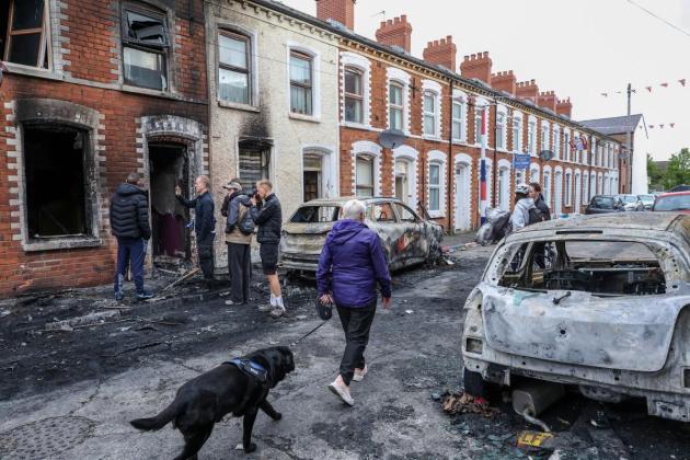 Belfast stabbing suspect due in court after night of anti-migrant violence