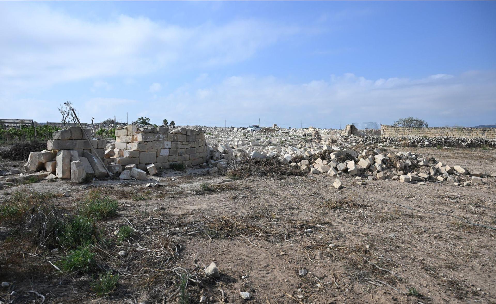 He owns 15 tumoli of agricultural land, now strewn with massive boulders. Photo: Matthew Mirabelli