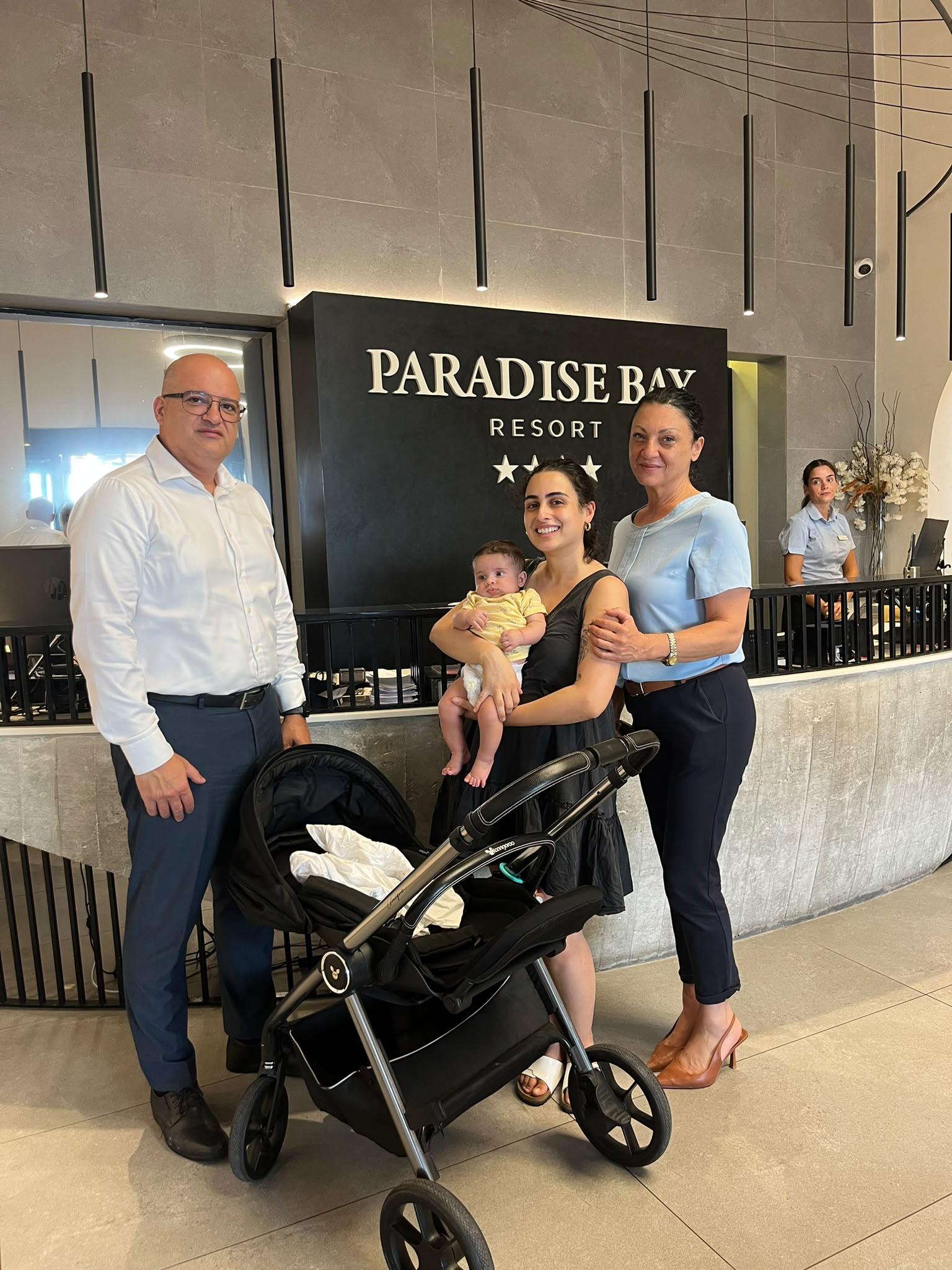 The manager of the Paradise bay hotel, baby Brando, Carolina Vergognini and her mother. Photo: Carolina Vergognini