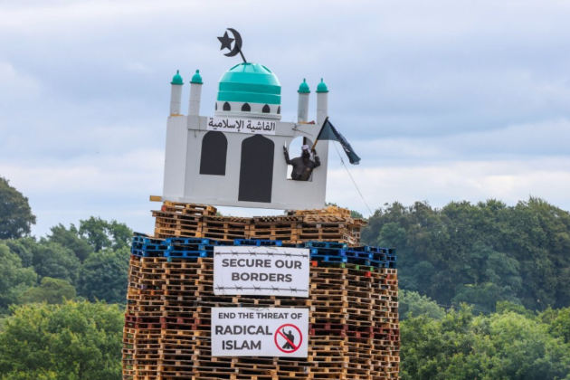 Man arrested over mosque effigy on loyalist bonfire in Northern Ireland