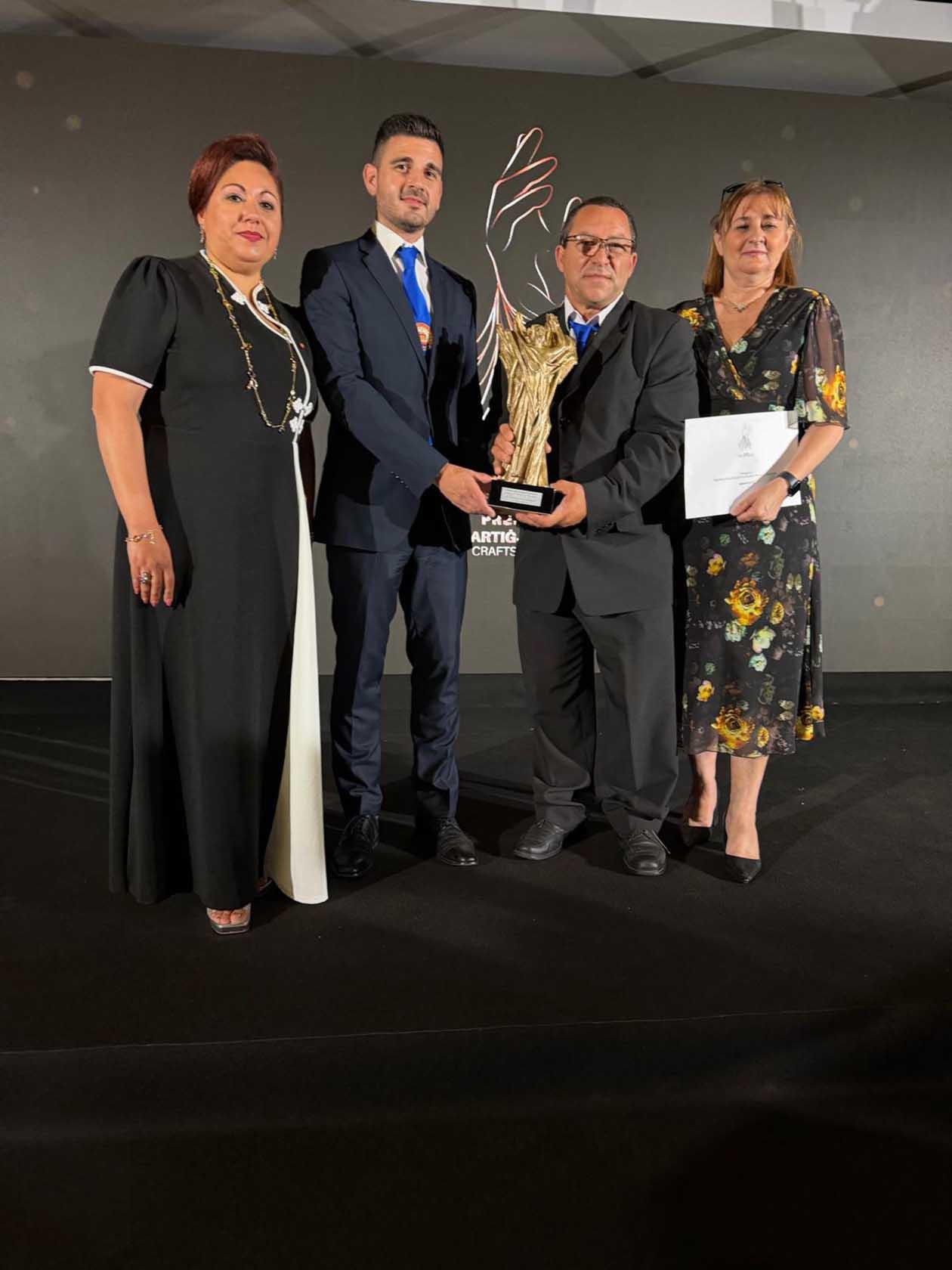 Santa Marija Society representatives receiving the <em>Premju Nazzjonali Ġieħ l-Artiġjanat Malti 2025</em>.