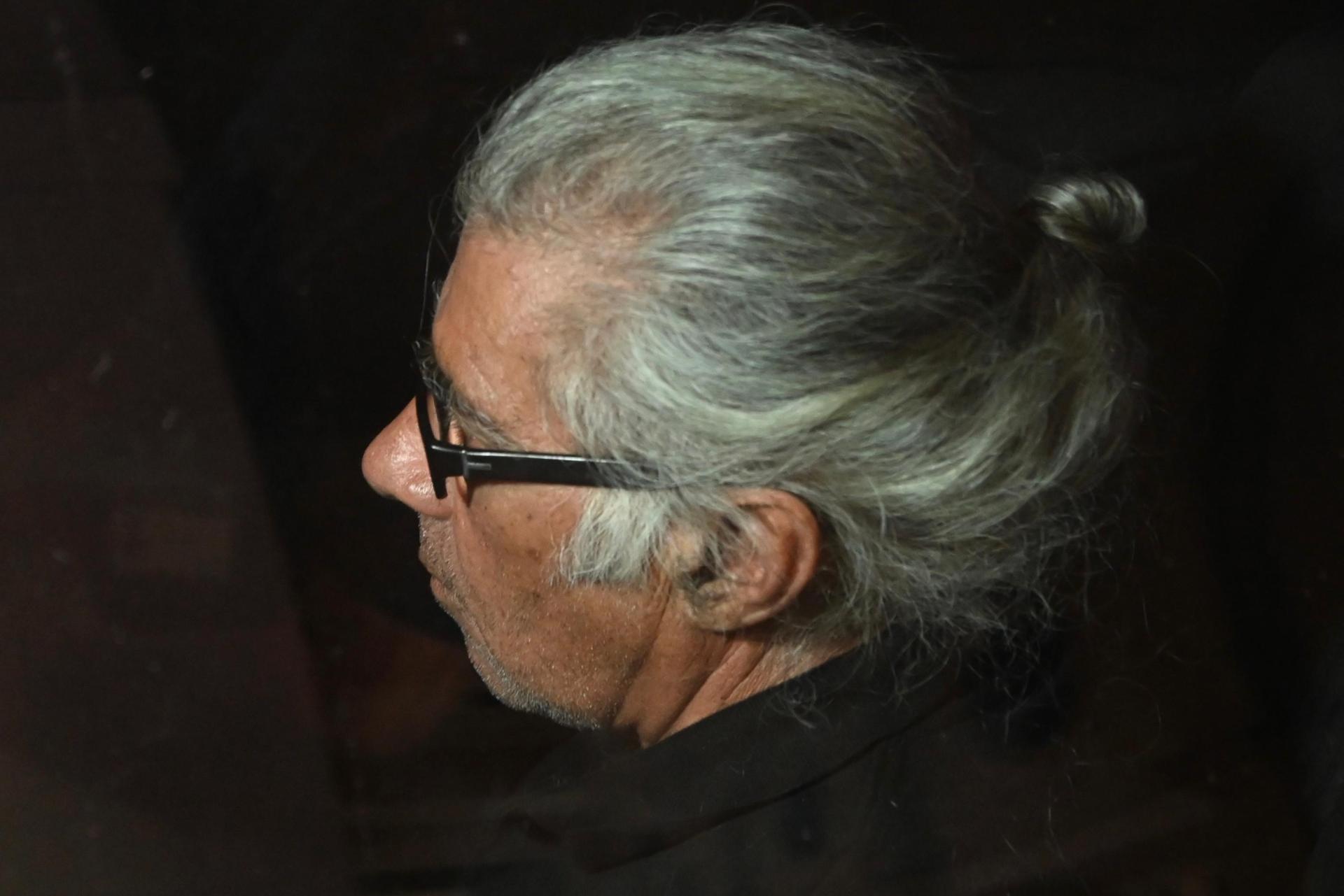 The accused John Agius is driven out of the court building on Sunday. Photo Jonathan Borg.