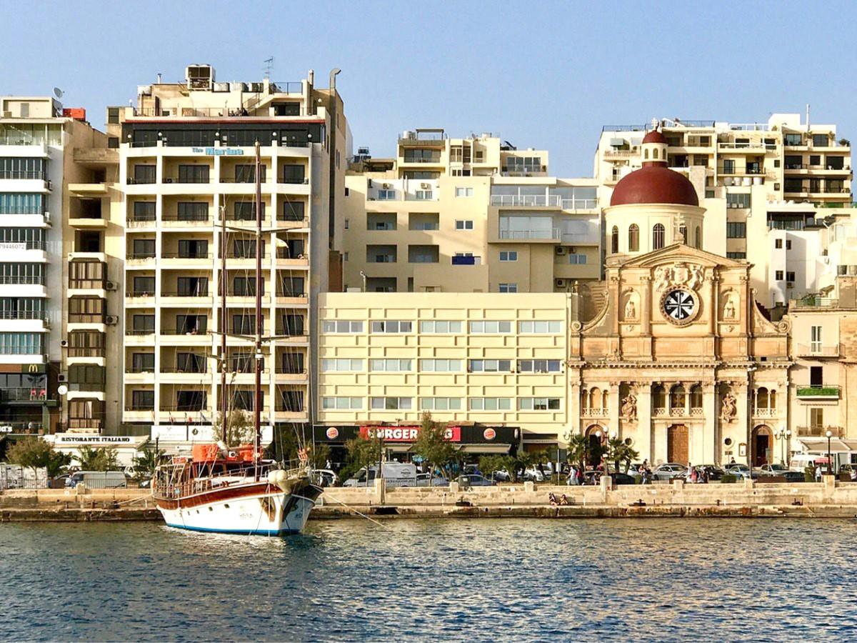 Dwarfed by high-rises, the Nazarene church in Tign&eacute; is now hardly visible.