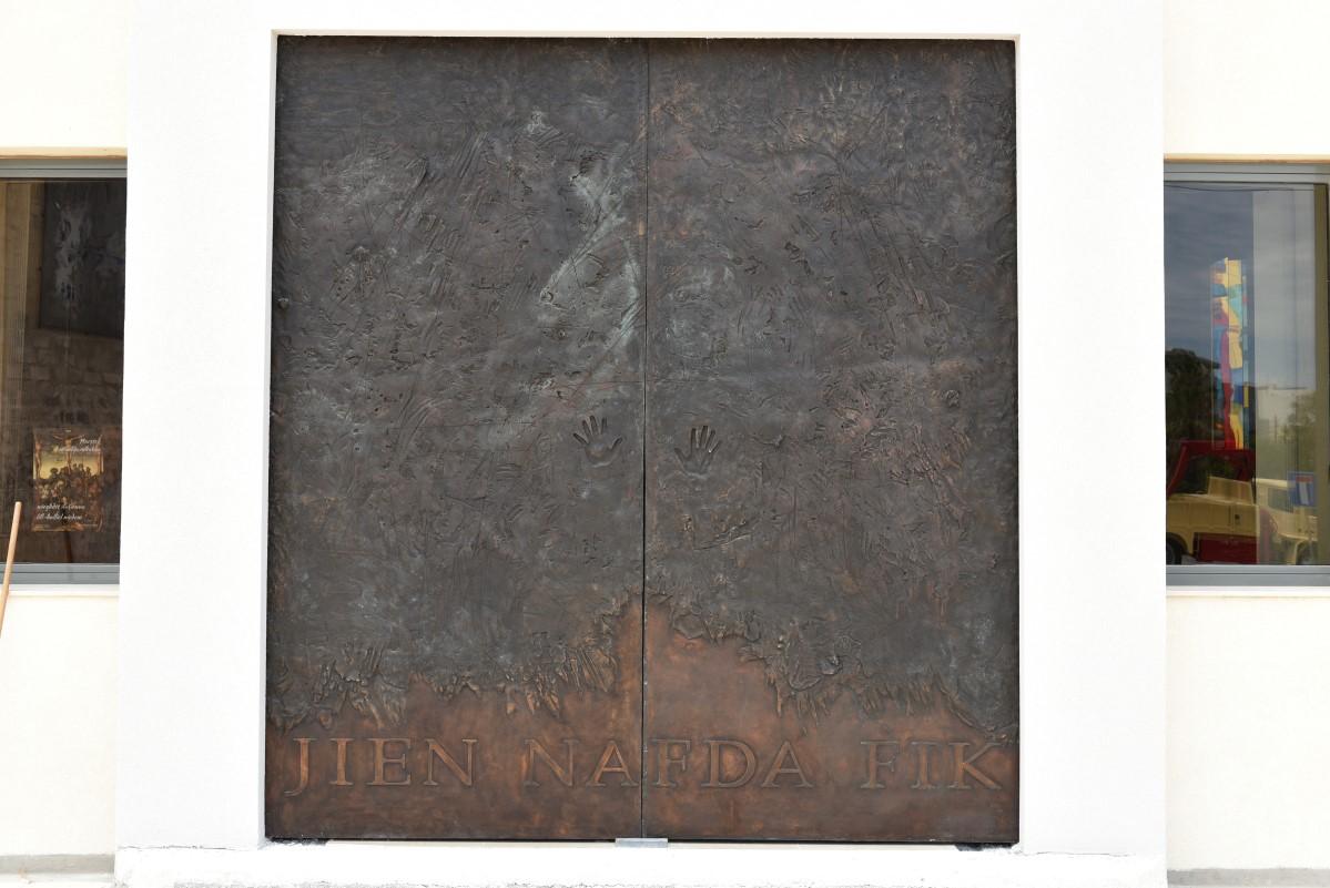 On the main door, two handprints constantly invite people to enter the sanctuary.