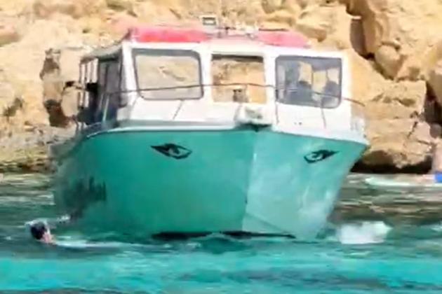 Watch: Boat narrowly misses swimmer in Comino