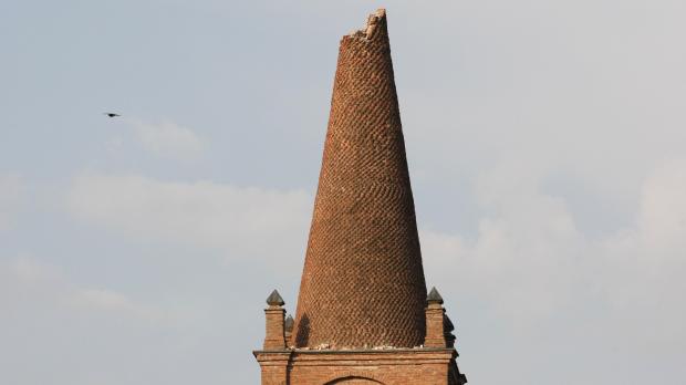 The damaged bell tower of a church in Santuario. Photo: Pierre Teyssot, AFP