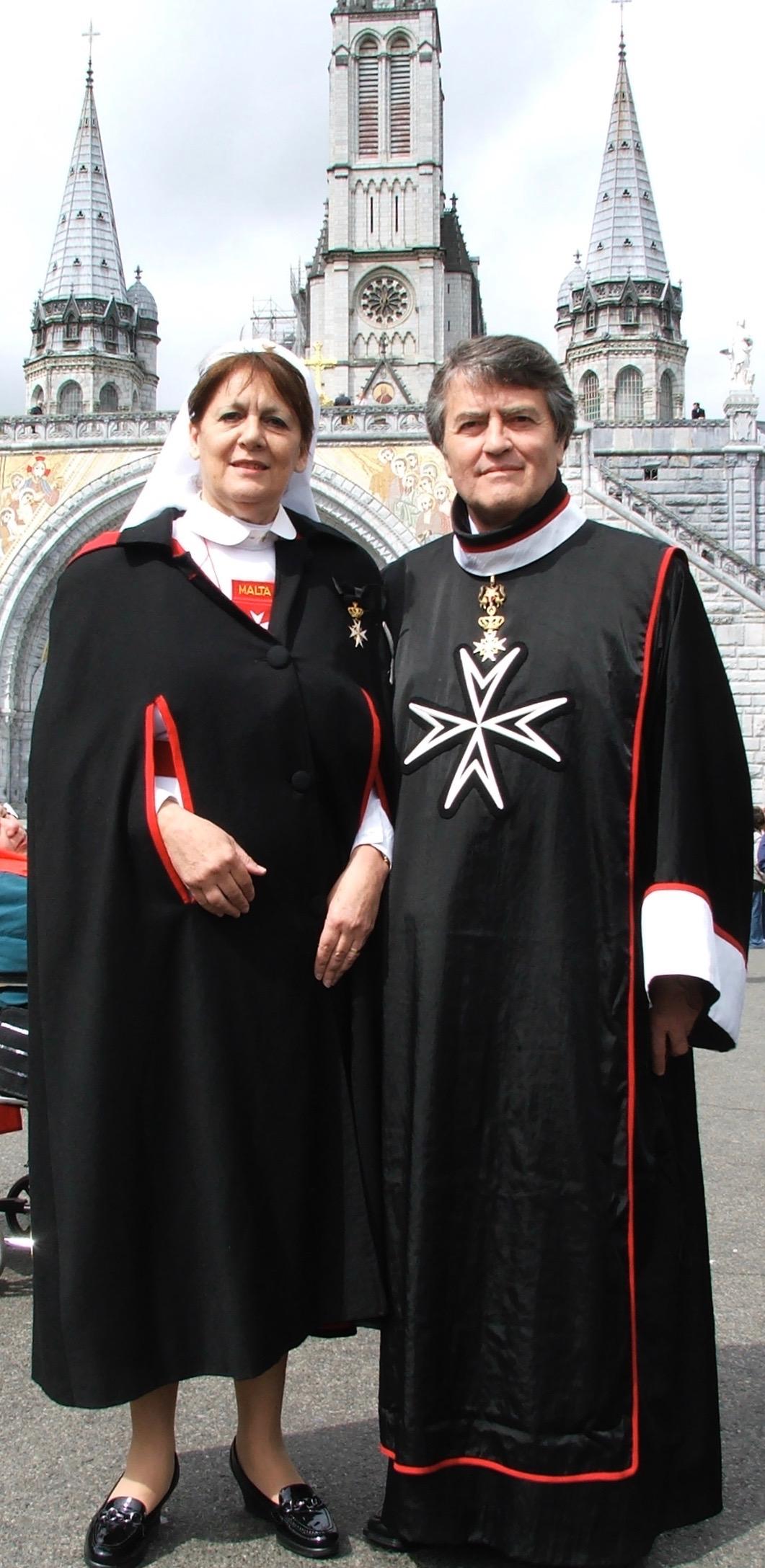 Philip with his wife, Helen, performing charitable works with the SMOM in Lourdes.