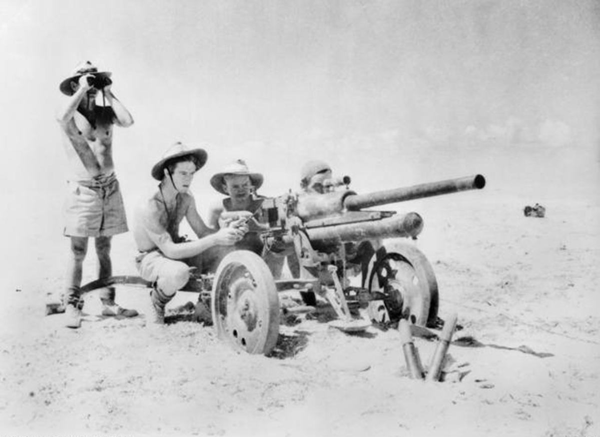Australian soldiers from 9th Division using a captured Italian Breda 47mm anti-tank gun in Egypt, September 1942. Photo: Australian War Memorial