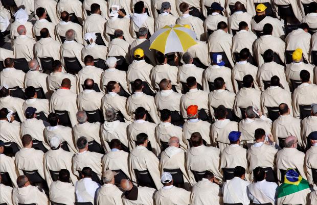 Clergy members sit as they wait for Pope Francis to arrive in St Peter's square. Photo: Reuters