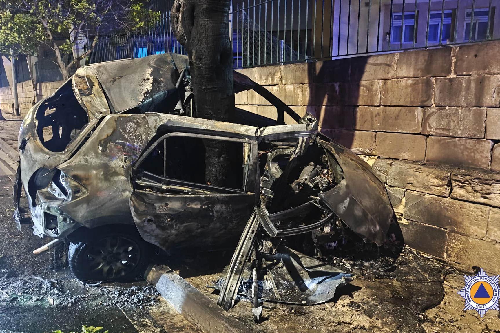 The wrecked car wrapped around a tree at Tal-Barrani. (Civil Protection Department)