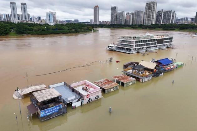 Rescuers search for missing in China storms after 17 killed, 130,000 evacuated