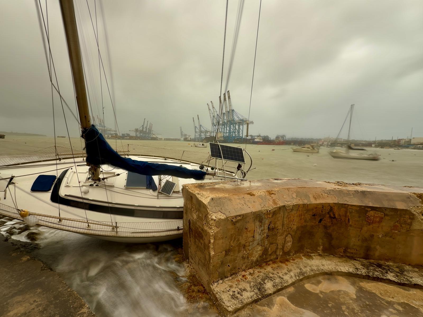 A sailing boat crashed against shore in Birżebbuġa. Photo: Jonathan Borg
