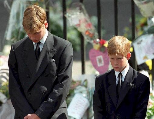 File: Prince William (left) and Prince Harry, the sons of Diana, Princess of Wales, bow their heads as their mother's coffin is taken out of Westminster Abbey following her funeral service on September 6, 1997. Photo: Adam Butler / pool / AFP