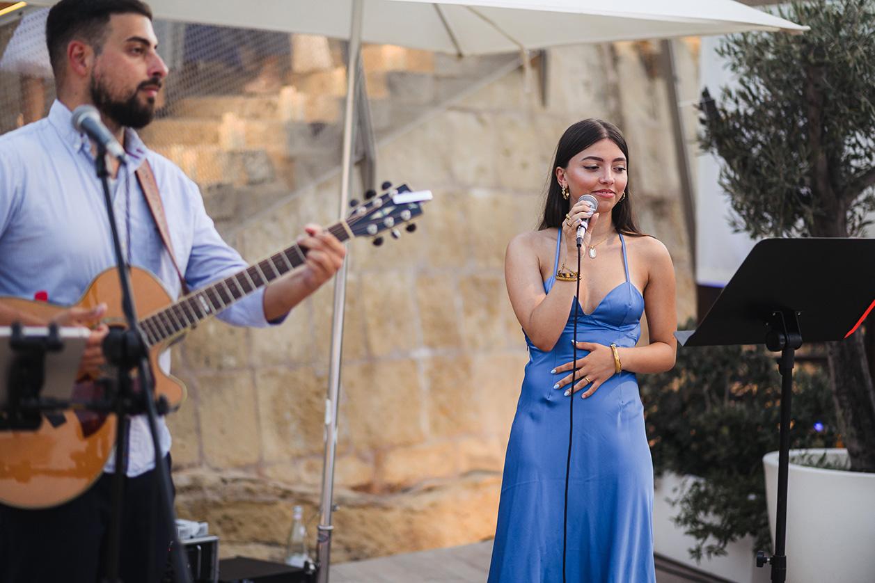 Singer Amelia during an acoustic set. Photo: Albert Camilleri