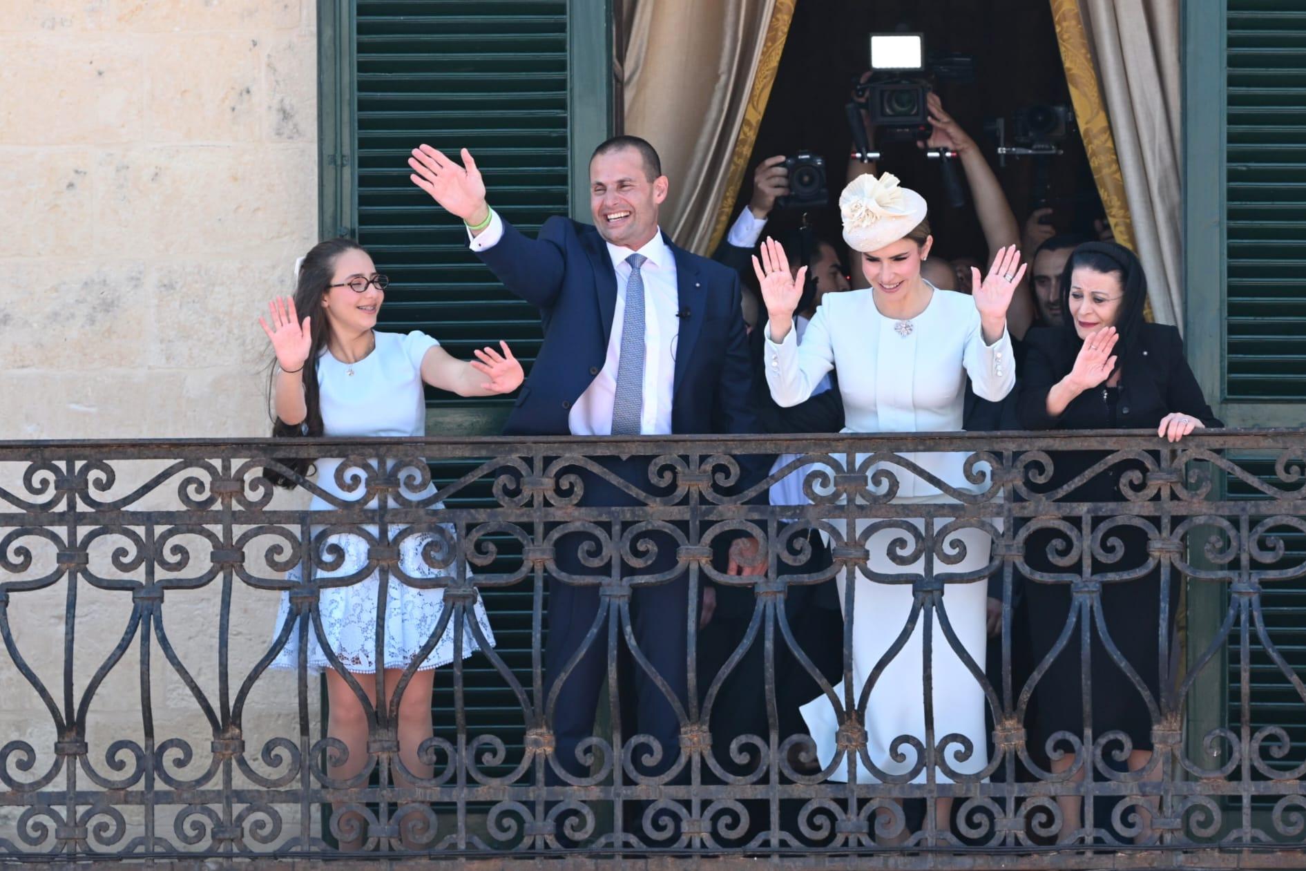 President Myriam Spiteri Debono, the prime minister and his family wave from the palace balcony.