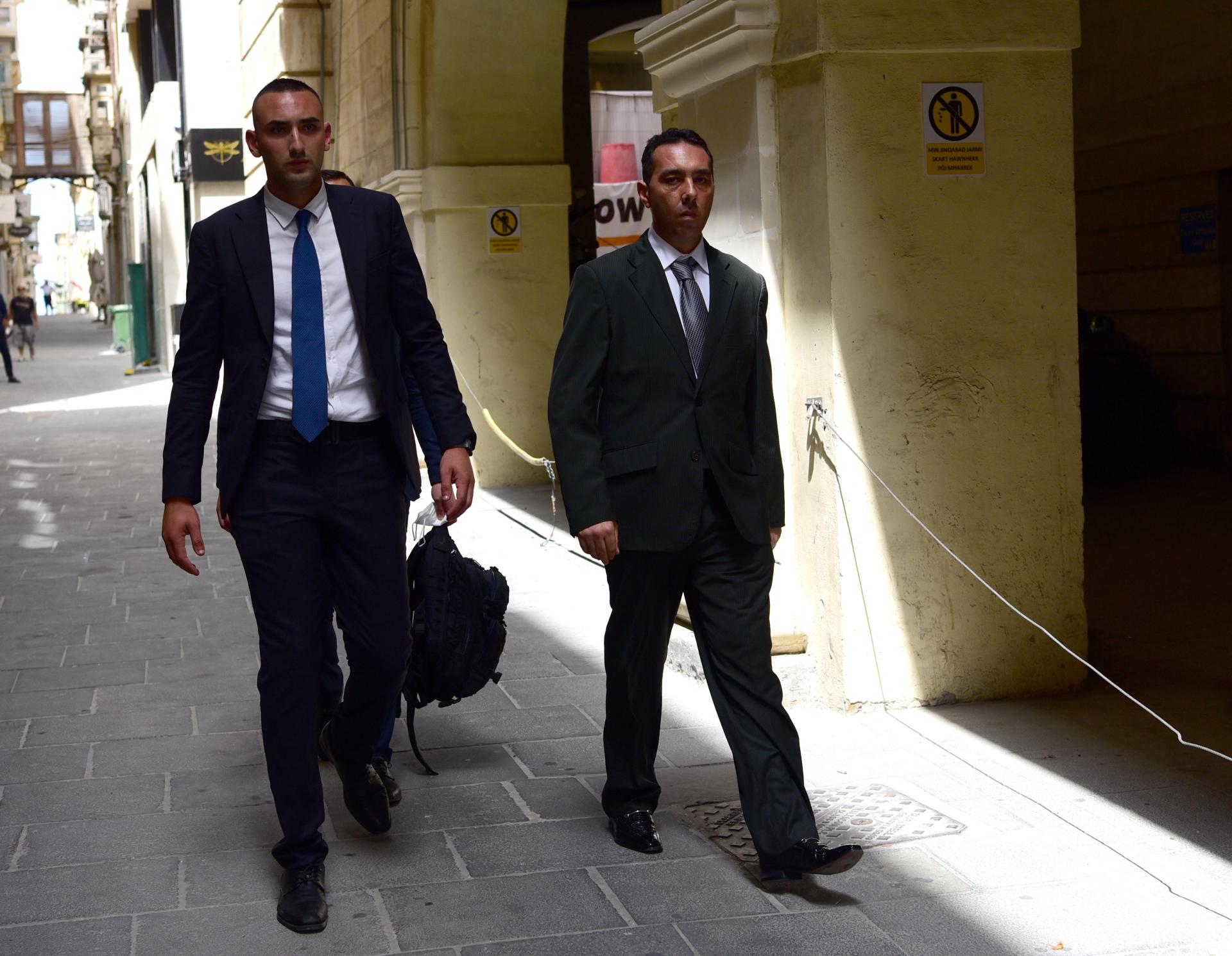 Melvin Theuma walking down Strait Street in Valletta.