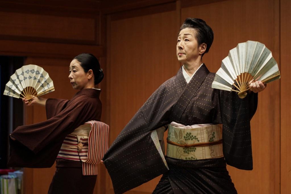 Shinbashi geisha Koiku (right) taking part in a rehearsal under the watchful eyes of instructors.