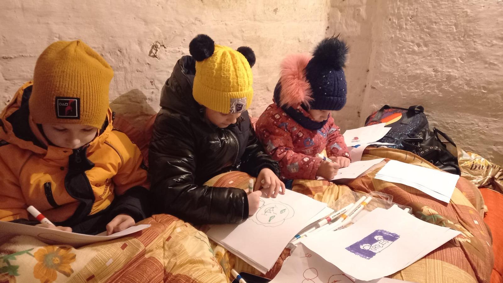 After February 24, 2022, the Samoilenko family would spend nights in the cellar. The children would wear headphones and draw to distract themselves from the sound of missiles outside. Photo: Oxsana Samoilenko