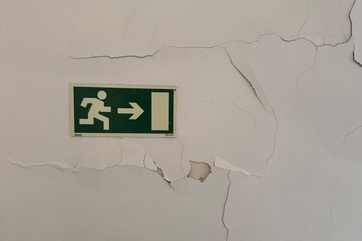 Visible cracks in the internal walls inside the building