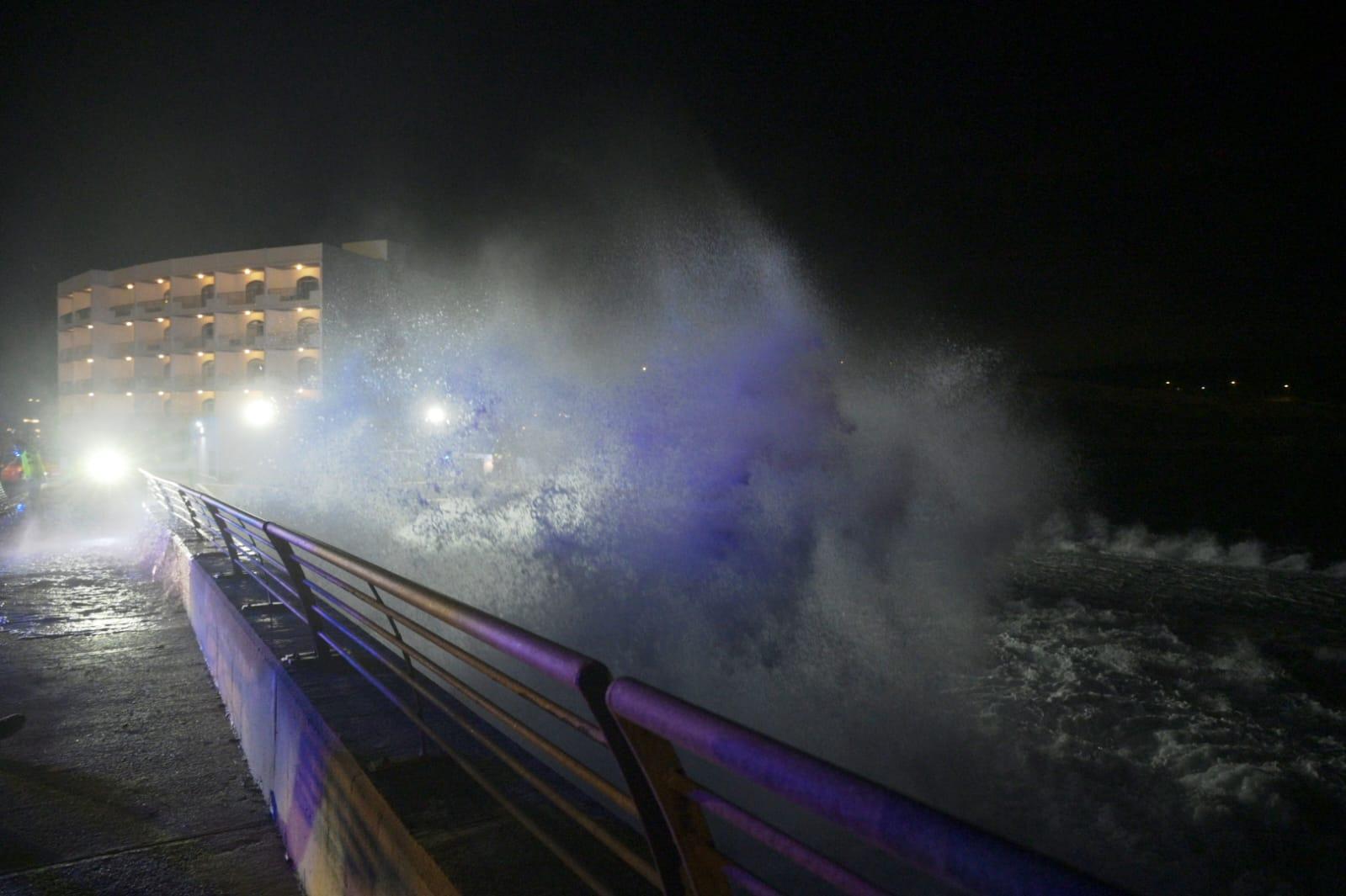 Waves crash against the quayside at Ċirkewwa on Monday. Photo: Matthew Mirabelli