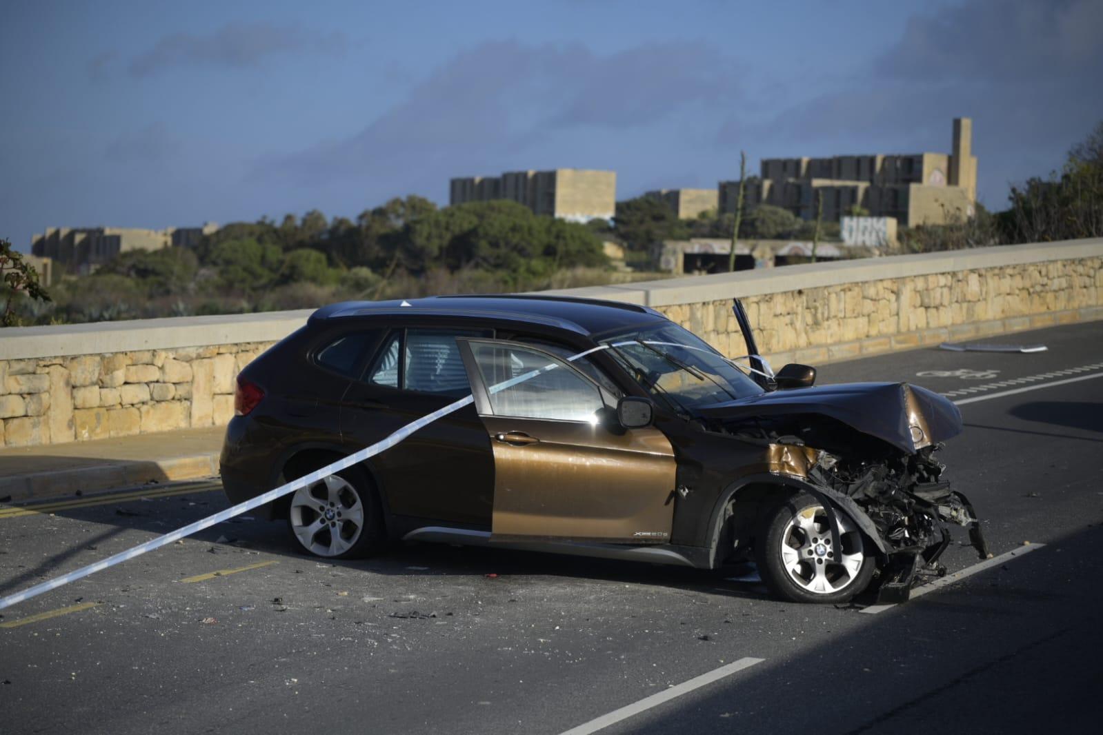 The metallic-coloured BMW could be seen concertinaed, lying across the road. Photo: Matthew Mirabelli.