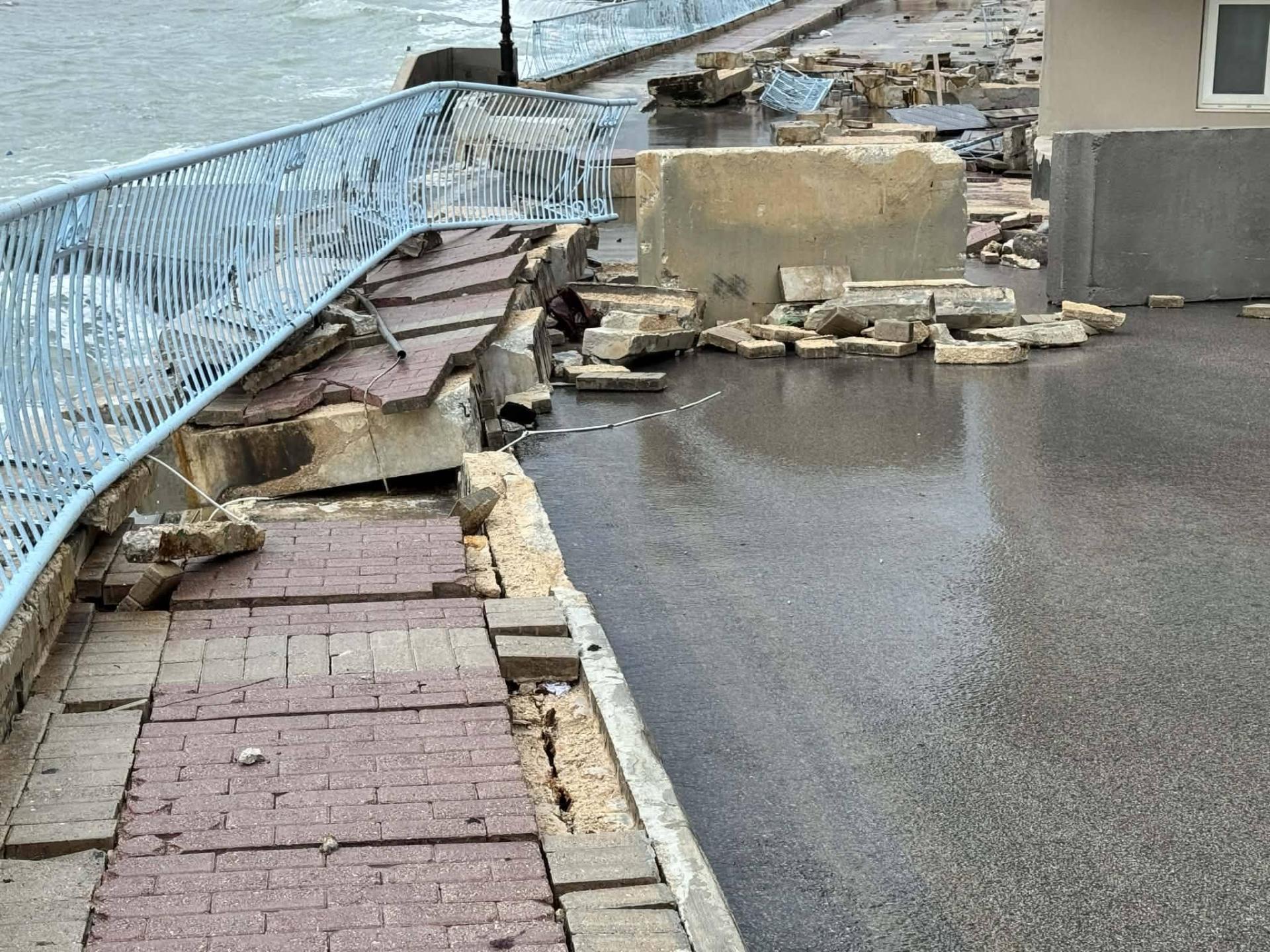 The parts of the pavement on Triq iz-Zonqor in Marsascala ended up in the road, as the infrastructure was heavily damaged by rough seas and the storm on Tuesday evening. Photo: Facebook/ Travel Malta