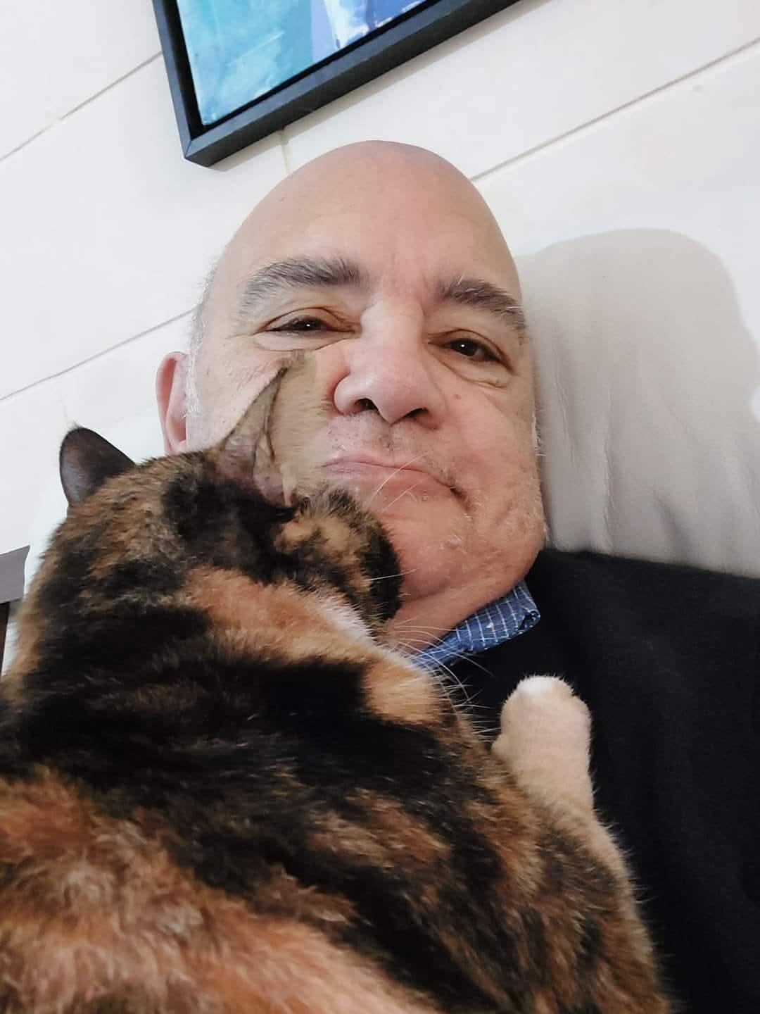 Ray Bondin and his cat Thea.