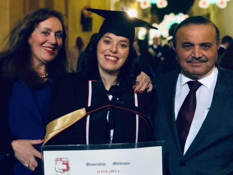 Fleur Abela, centre, with her parents. Photo: Fleur Abela/Facebook