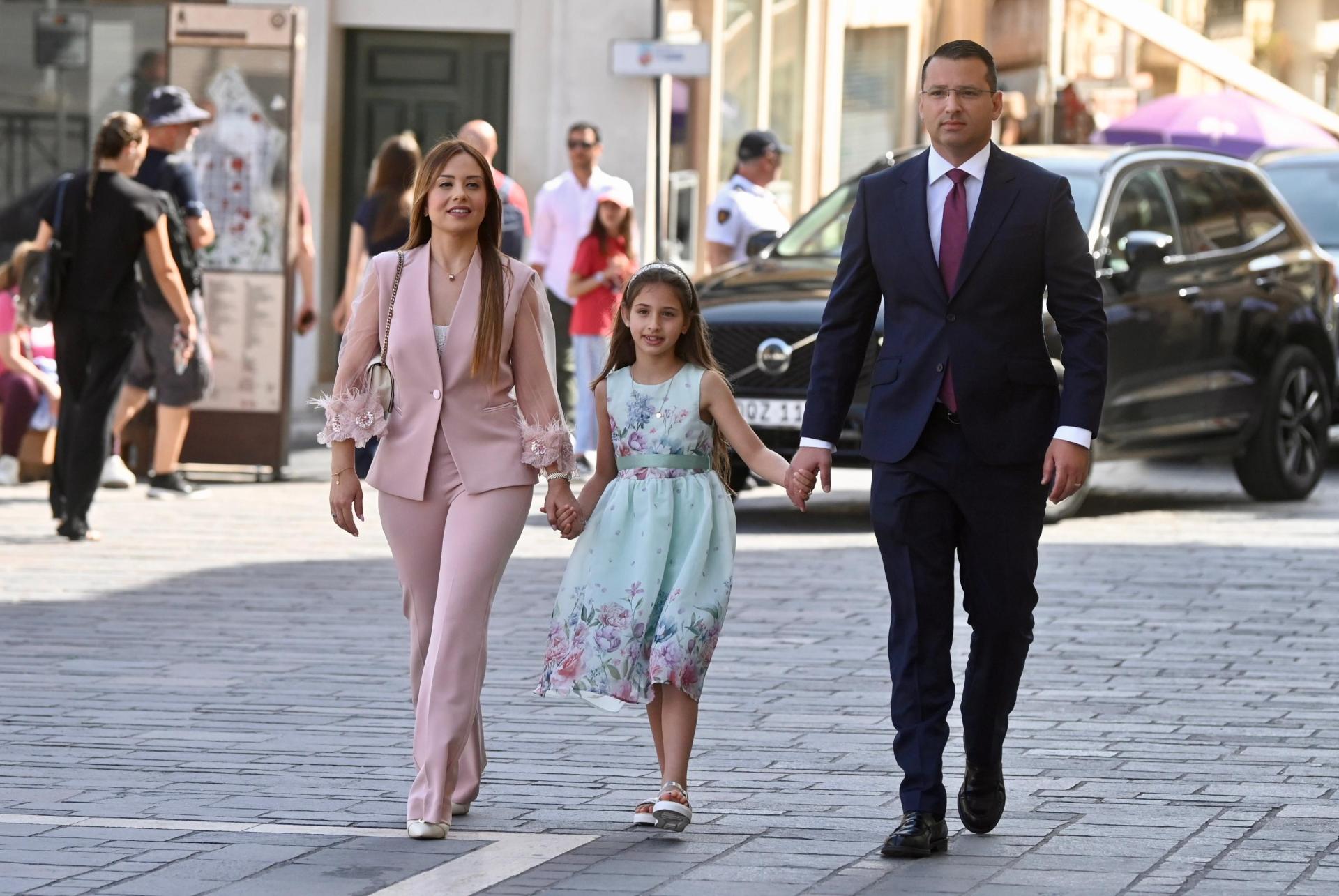 Jonathan Attard, who was handed a super ministry for planning, infrastructure and employment, arrives with his family for the ceremony. Photo: Jonathan Borg