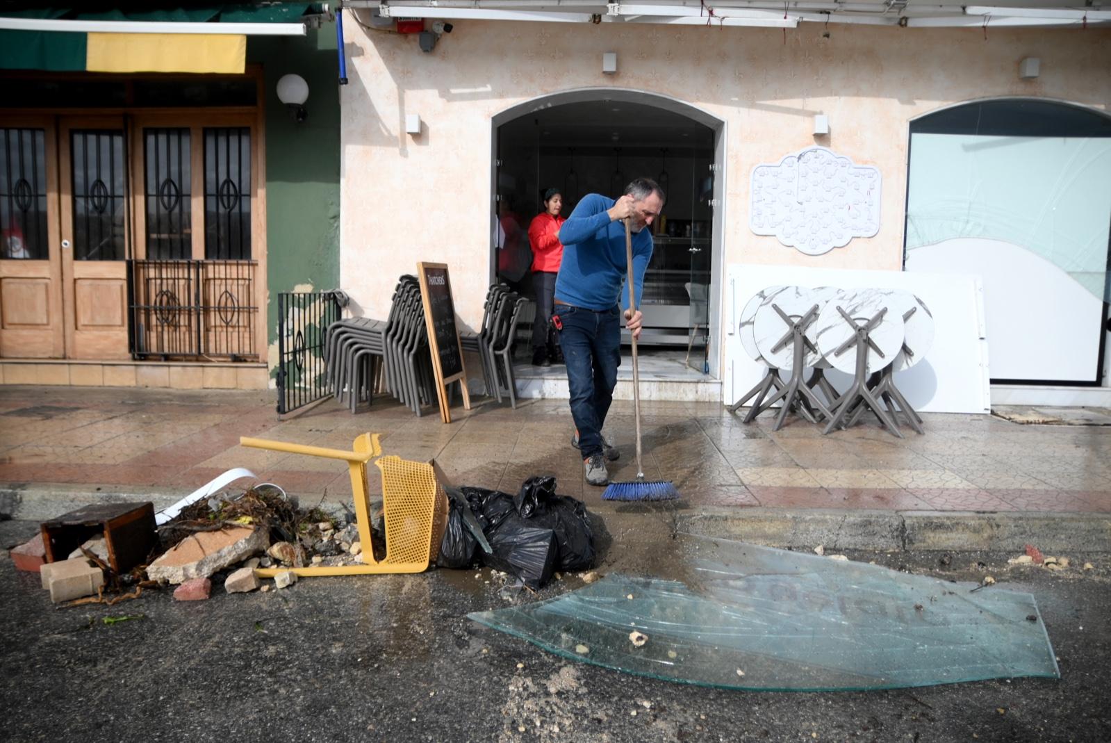 Volunteers cleaning up Marsascala, which was hit heavily by Storm Harry. Photo: Jonathan Borg